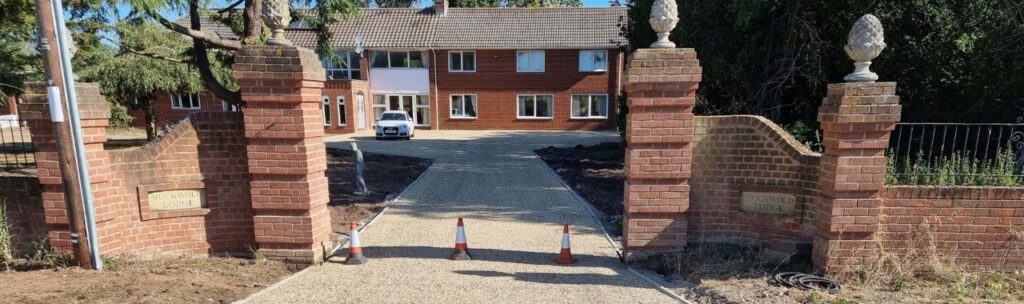 This is a photo of a newly installed chip and tar driveway, installed by Dover Driveways